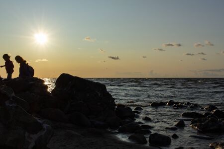 Baltic sea rocky beach at sunset timeの写真素材