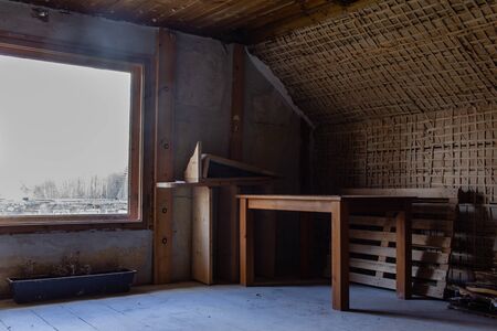 Under construction room table and window view, old wallsの写真素材