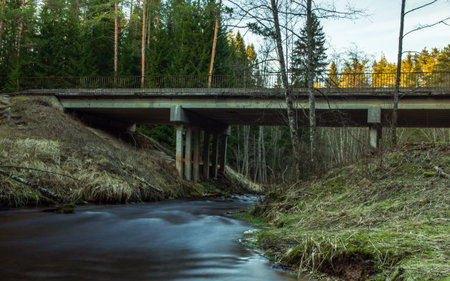 Small country side bridge, dark river viewの写真素材