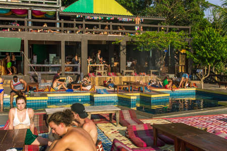 Koh Phangan, Thailand- April 20 2019: Amsterdam bar visitors and pool, relaxing time.のeditorial素材