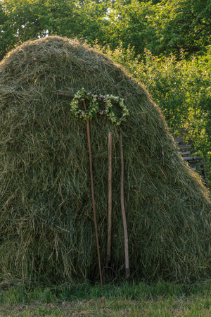 Flower crown on old grass wall at midsummer festival time