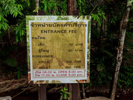 Krabi town, Thailand- March 28 2019: Emerald pool entrance fee sign, prices to get in and working timeのeditorial素材