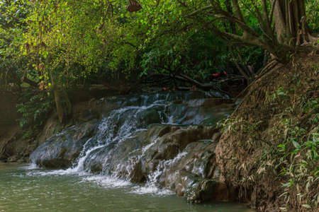 Krabi town, Thailand- March 28 2019: Klong Thom hot springs waterfall. It is said that the waters of these springs are said to ease quite a number of ailments including rheumatism, sciatica and skin irritations. And if you're looking to cool down after a のeditorial素材