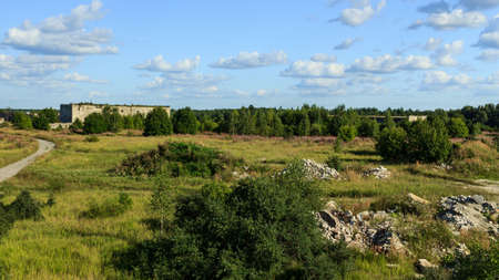 Rummu, Estonia- August 19 2020:The Rummu quarry is a submerged limestone quarry. Green nature view and blue skyの写真素材