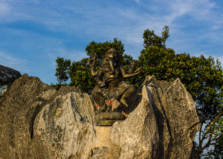 Krabi, Thailand- March 29 2019: Tiger temple gold architecture decorative corner, bronze elephant head and people heand statue, cultural artのeditorial素材