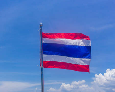 Thailand flag in a windy day, blue sky with cloudsの写真素材