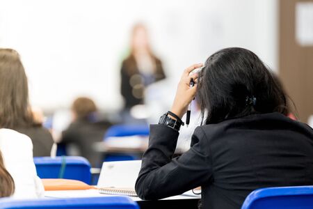 Students studying hard in classの写真素材