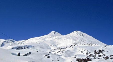 Caucasus mountains under the snow and clear sky. Elbrus