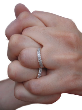 Two hands two rings and two hearts