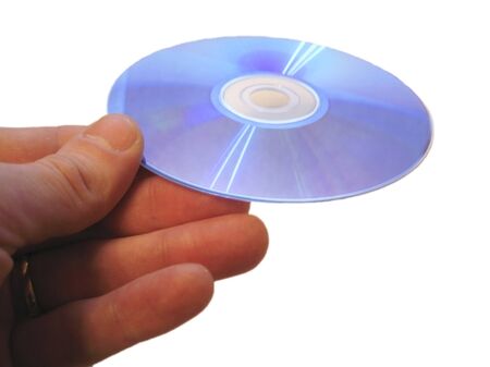 Compact disk and male finger isolated on the white backgroundの写真素材