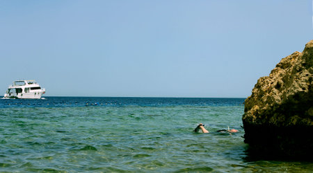 White Ship Moving By The Red Seaの写真素材