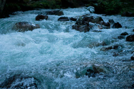 Mountain river run away after the sunsetの写真素材