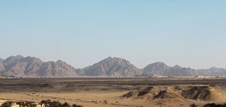 Egyptian Desert And Mysty Sky In The Daylightの写真素材