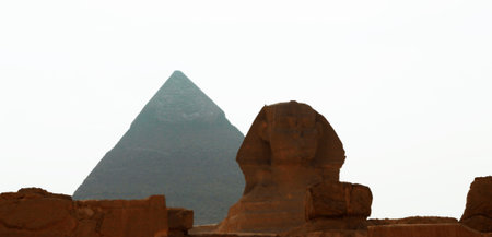 Sphinx statue and pyramid in Giza Egypt. Ancient architecture