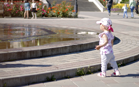 Children near a splashing fontain in the center of town 12 June 2016 Pyatigorsk, Russia, Town Squareのeditorial素材