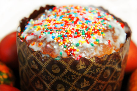 Easter Cake and colorful painted eggs on the black plate