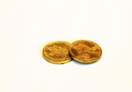 Stacks of Russian coins laying on the white background. Ten rubles with Republic Krym and Sevastopol