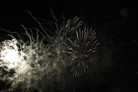 The Celebration blazing firework flashing in the black night skyの写真素材