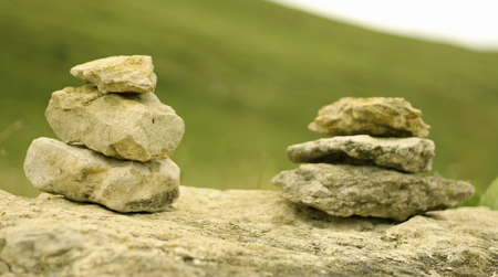 The Balanced stones on the alpine field near caucasus mountains. Concept of tranquil stateの写真素材