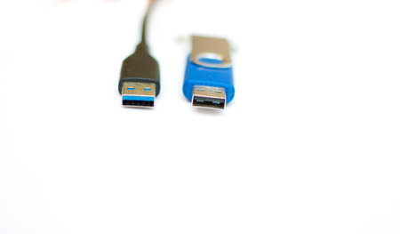 The USB cable and usb flash memory isolated on the white background