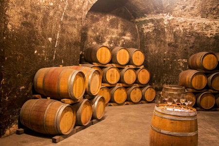An Old wooden grunge barrels in the wine cellar of monastery