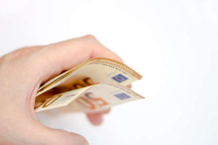 Man hold a Stack of Fifty euro banknotes isolated on white backgroundの写真素材