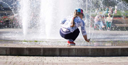 Children playing near a splashing fontain in the center of town 12 June 2016 Pyatigorsk, Russia, Town Squareのeditorial素材