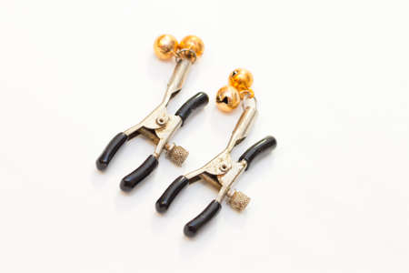 Pair of nipple clamps for sexual play isolated on a white backgroundの写真素材