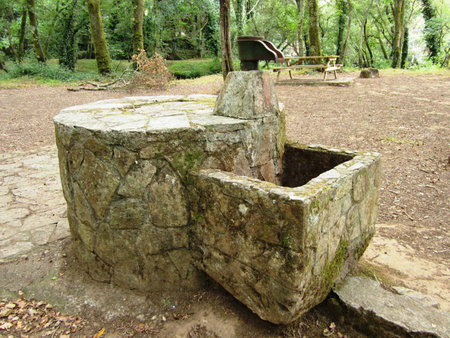 Fountain of stone water in recreation area in Sigüeiro
