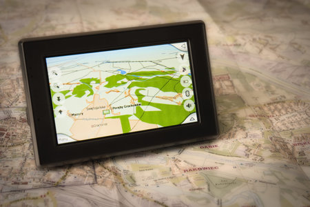 Portable GPS for a car sitting on a map