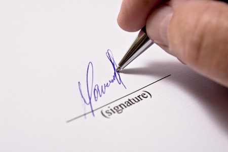 Man signing papers. The signature.の写真素材