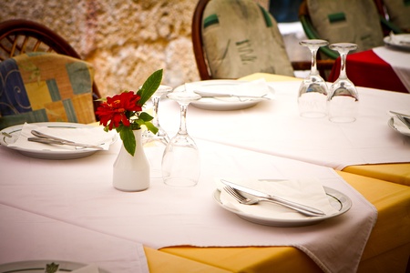 table in a restaurant ready for silver service diningの写真素材