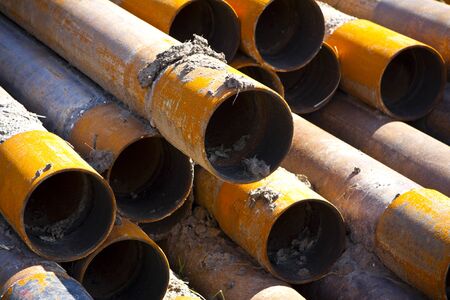 a stack of rusty steel pipesの写真素材