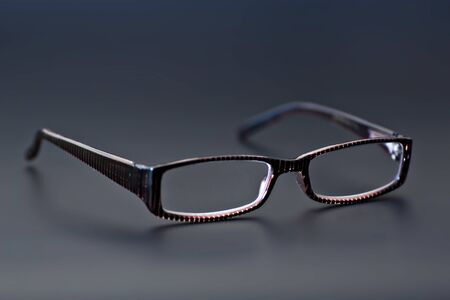 Glasses (Eyewear) in gray background. Shot in studio.の写真素材