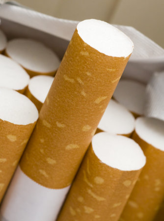 Open pack of cigarettes on white background with clipping path