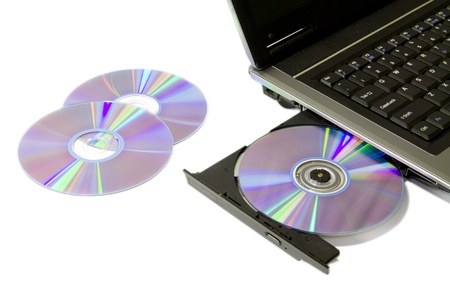 detail of a laptop with open and loaded dvd driveの写真素材