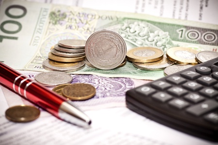 Money coins, calculator on the polish banknotesの写真素材