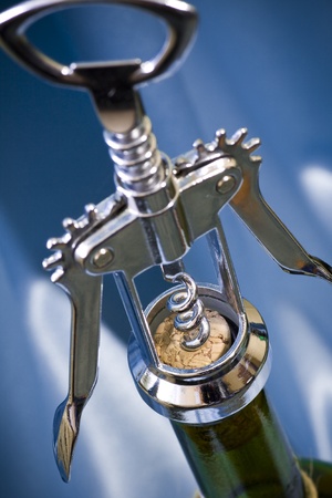 Close shot of a corkscrew opening a bottle of wine  Shallow dofの写真素材