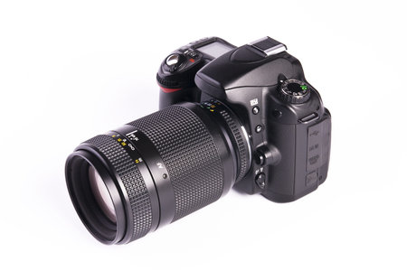 A DSLR camera mounted with a pro lens standard zoom 