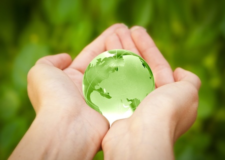 human hands carefully holding Earth planet  Glass Worldの写真素材