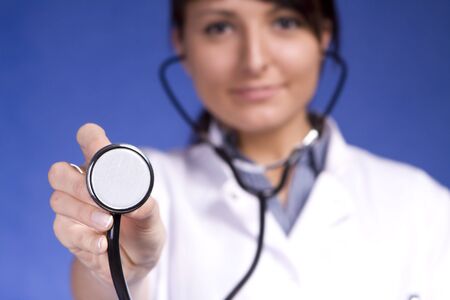 Nurse or doctor holding stethoscope  shallow Depth Of Field   の写真素材
