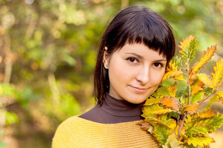 Autumn woman on leafs background の写真素材