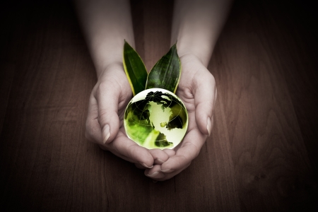 glass globe in handの写真素材