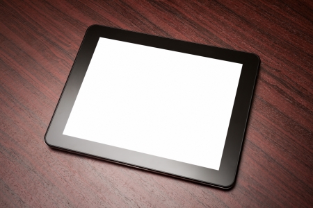 empty tablet on the brown table desk. Copy spaceの写真素材