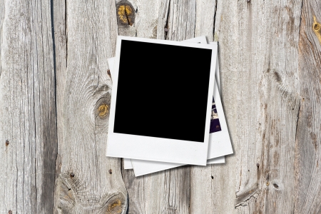 Blank instant photo frames on old wooden の写真素材
