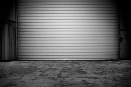 Building made of concrete with roller shutter doorの写真素材