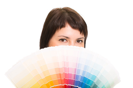 Young woman holding a color palette  Isolated white background の写真素材