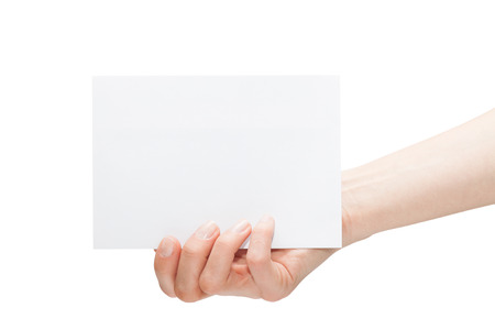 Female hand with a blank card isolated on whiteの写真素材