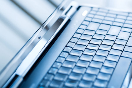 Closeup of a laptop keyboard  Blue tone color の写真素材