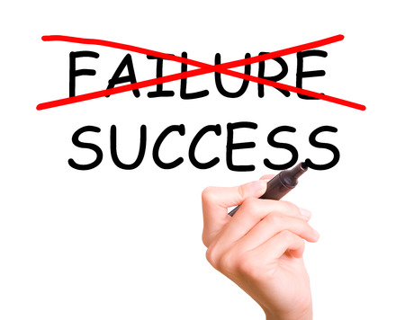 Woman hand crossing out failure and writing success on transparent wipe board の写真素材